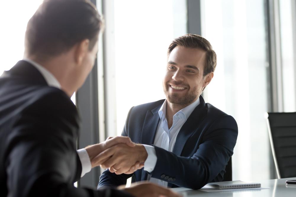 Two business men shaking hands